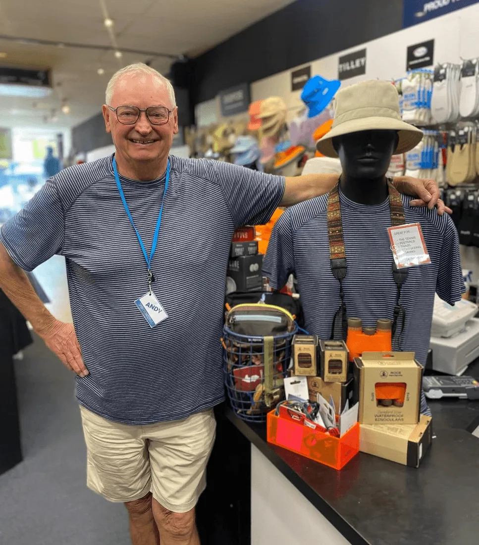 Andy smiling beside a mannequin inside the Sports Conscious Brighton store